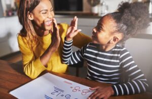 Mother and daughter high-fiving after Florida parenting classes
